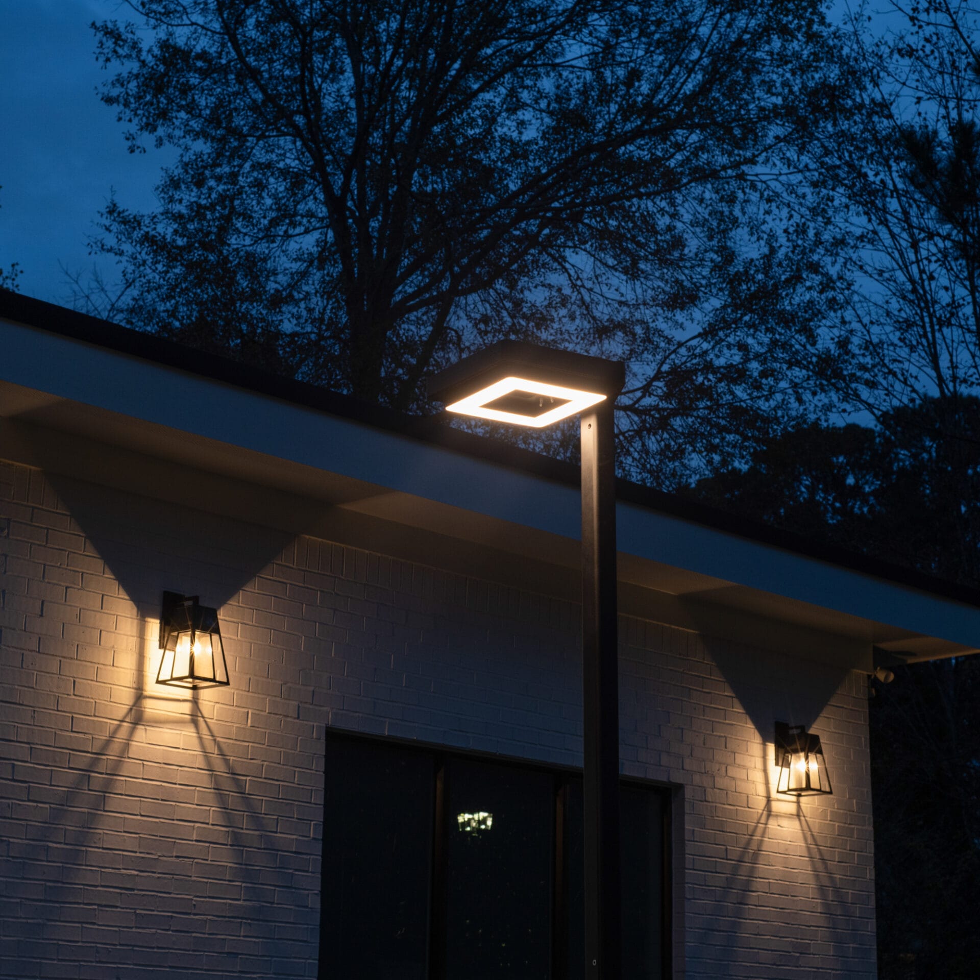 Gama Sonic contemporary solar lamp post illuminating modern walkway