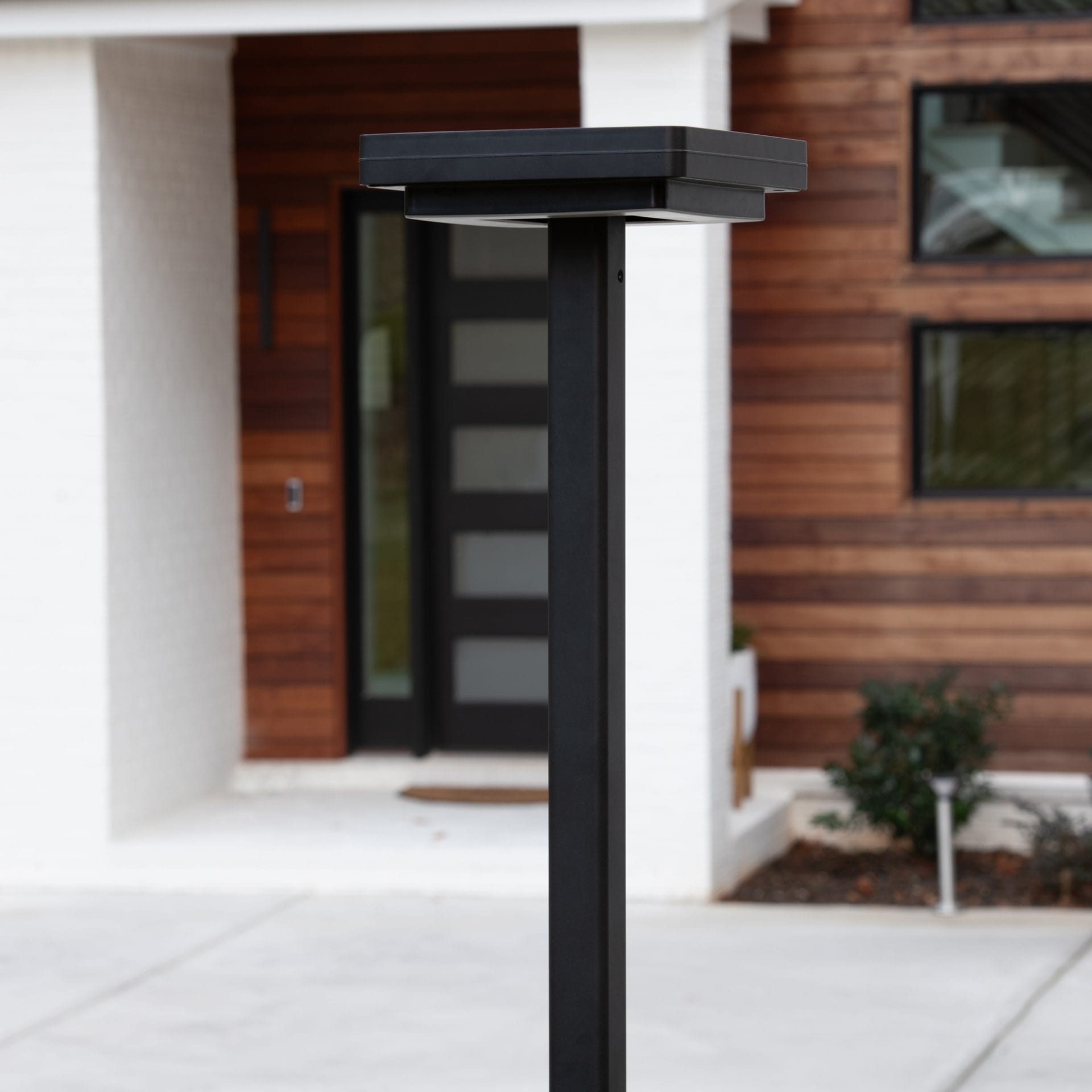 Gama Sonic contemporary solar lamp post illuminating modern walkway