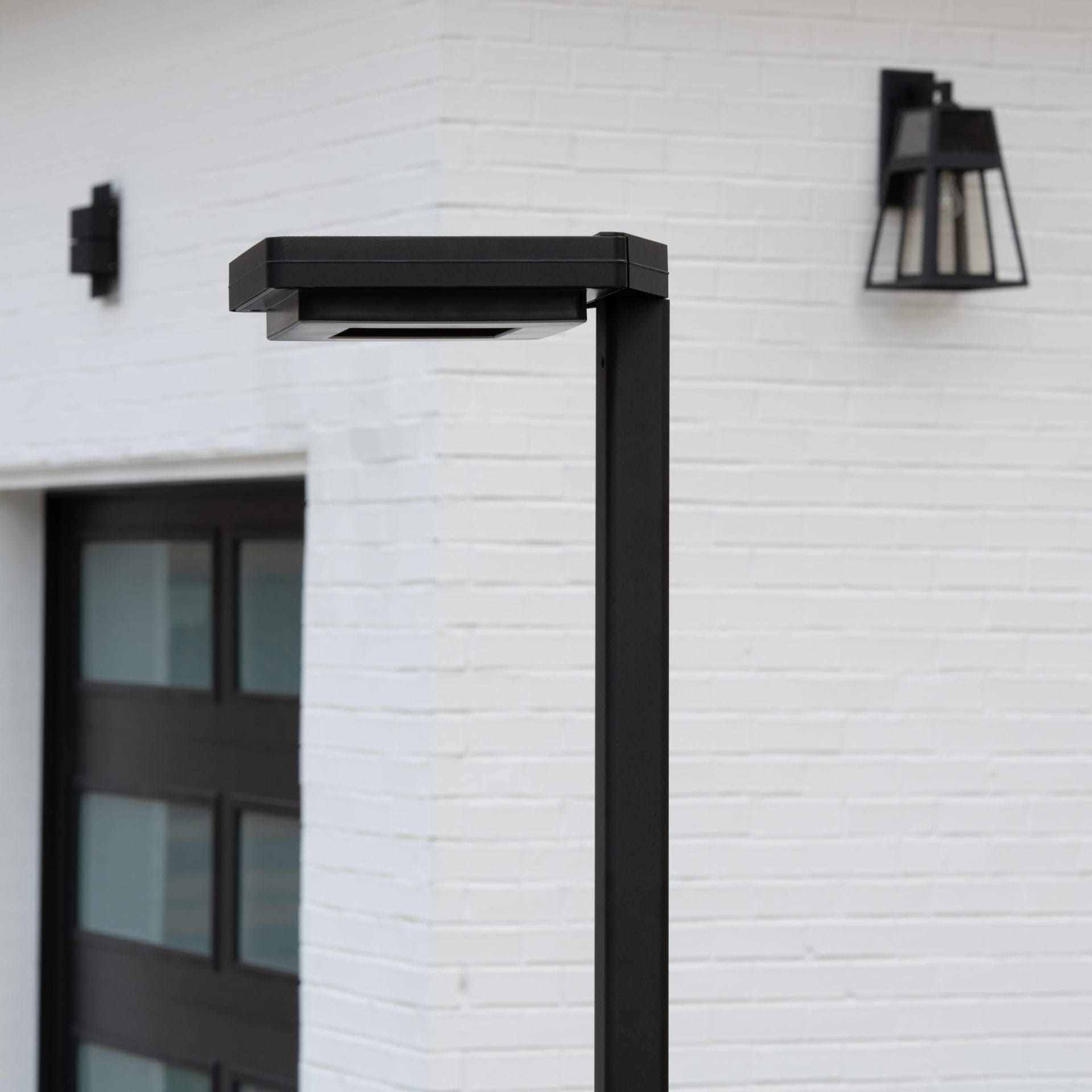 Gama Sonic contemporary solar lamp post illuminating modern walkway