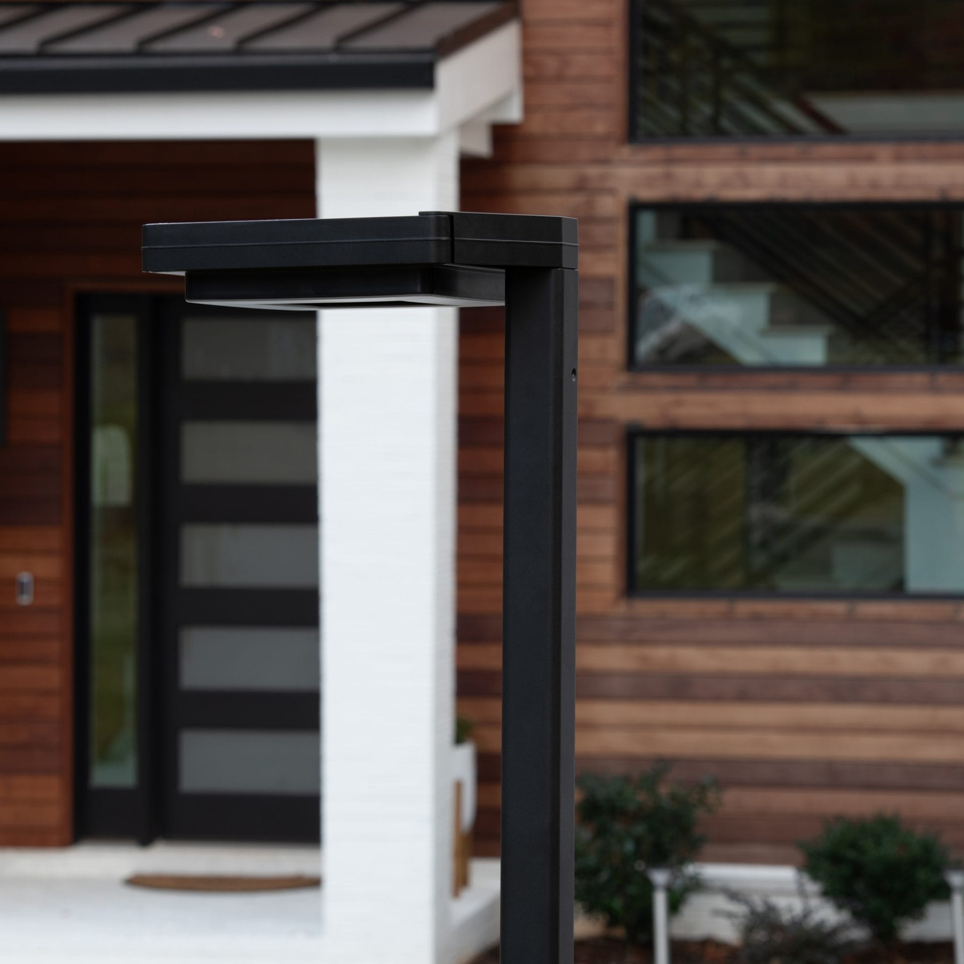 Gama Sonic contemporary solar lamp post illuminating modern walkway