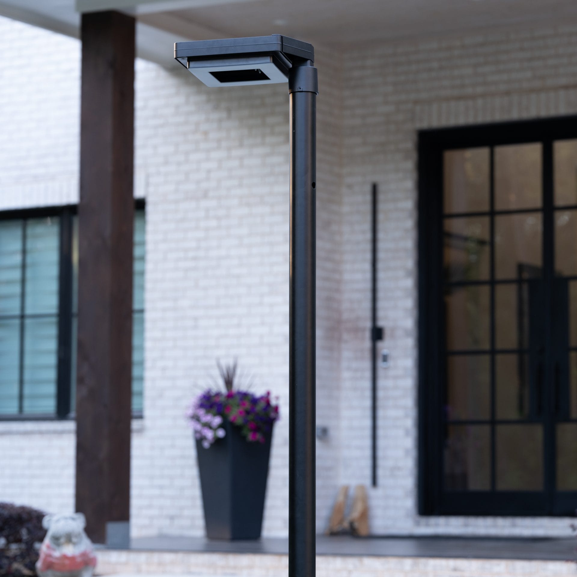 Gama Sonic contemporary solar lamp post illuminating modern walkway