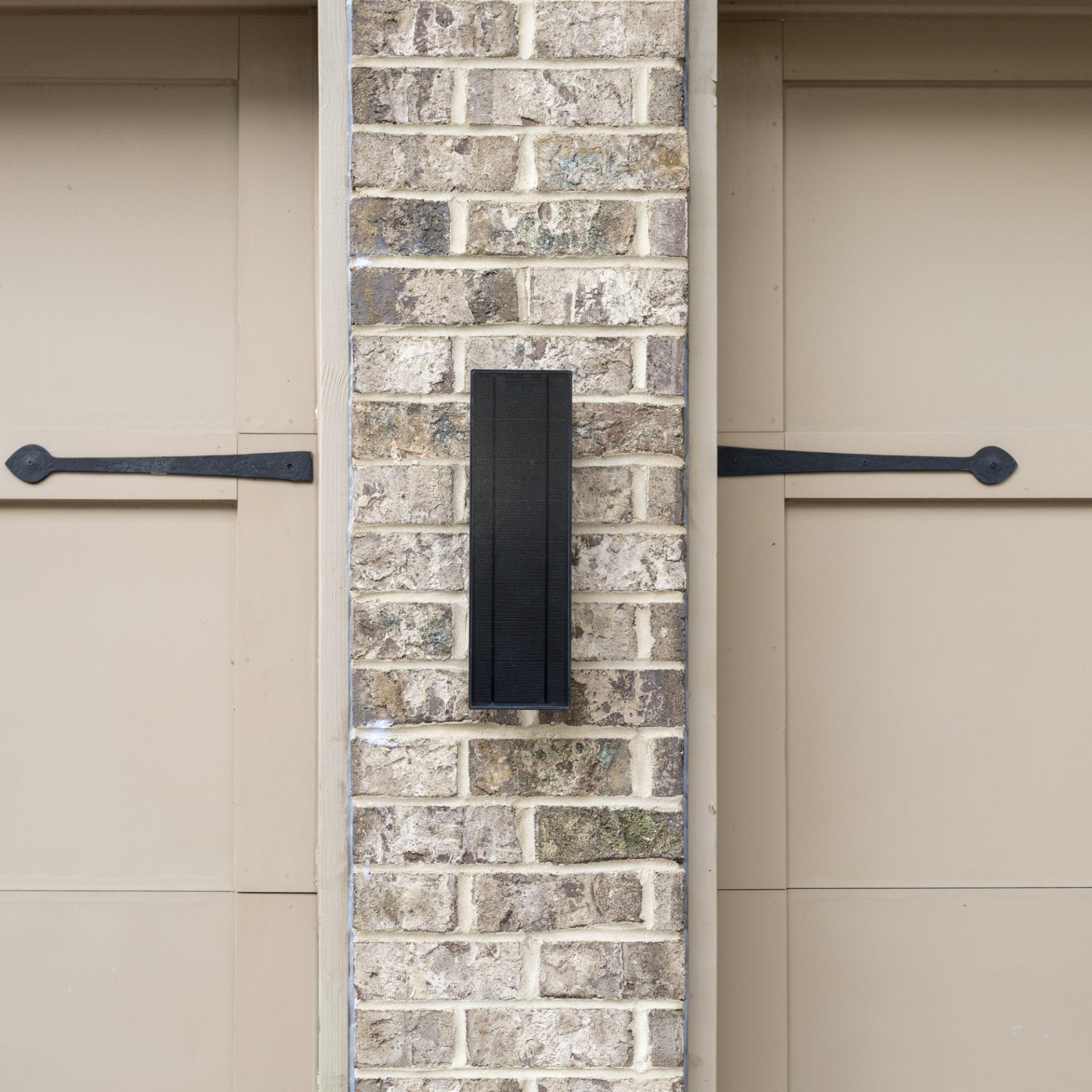 Slim vertical solar LED wall light with backlit halo glow