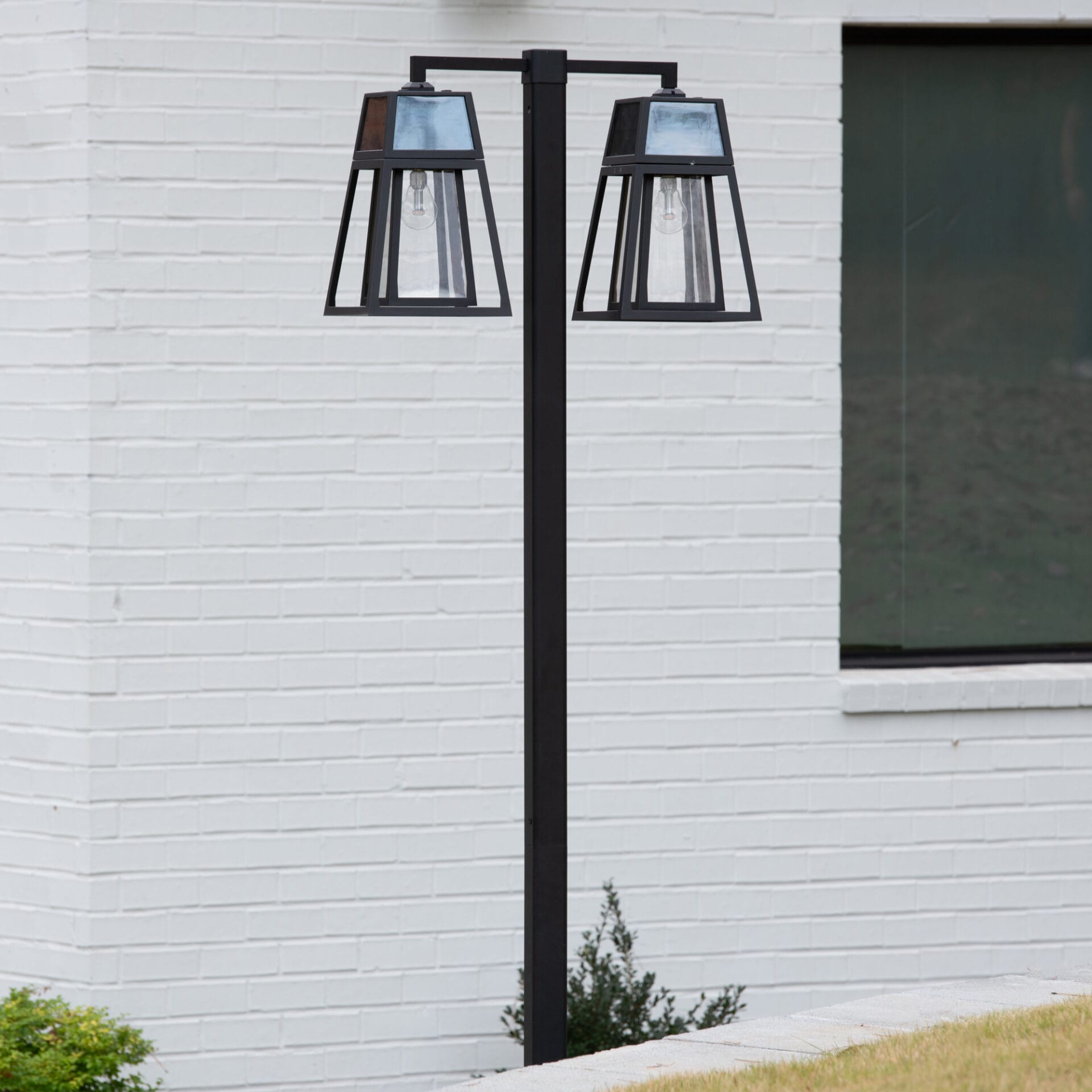 Gama Sonic Aria Dual-Head Solar Post Light illuminating driveway