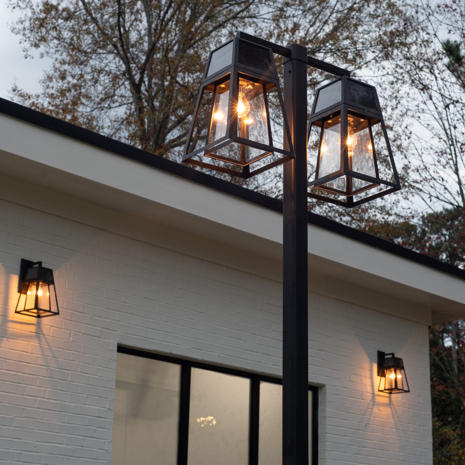 Gama Sonic Aria Dual-Head Solar Post Light illuminating driveway