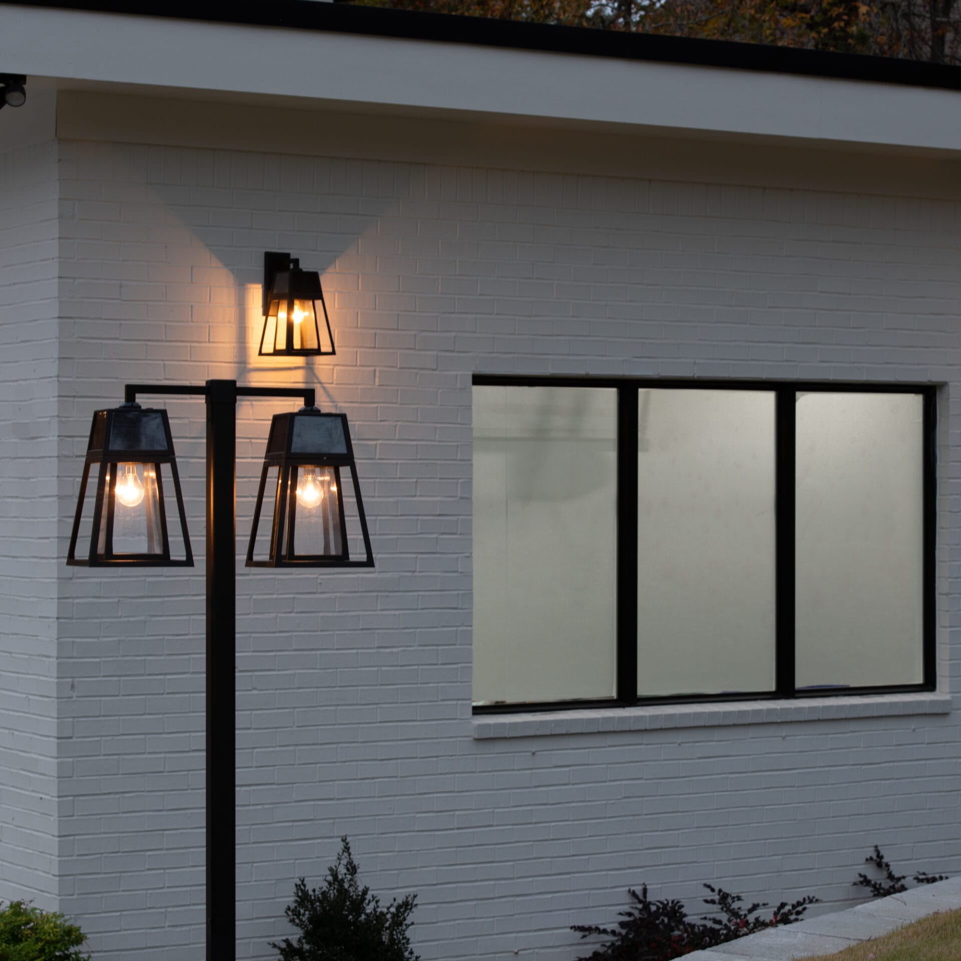 Gama Sonic Aria Dual-Head Solar Post Light illuminating driveway