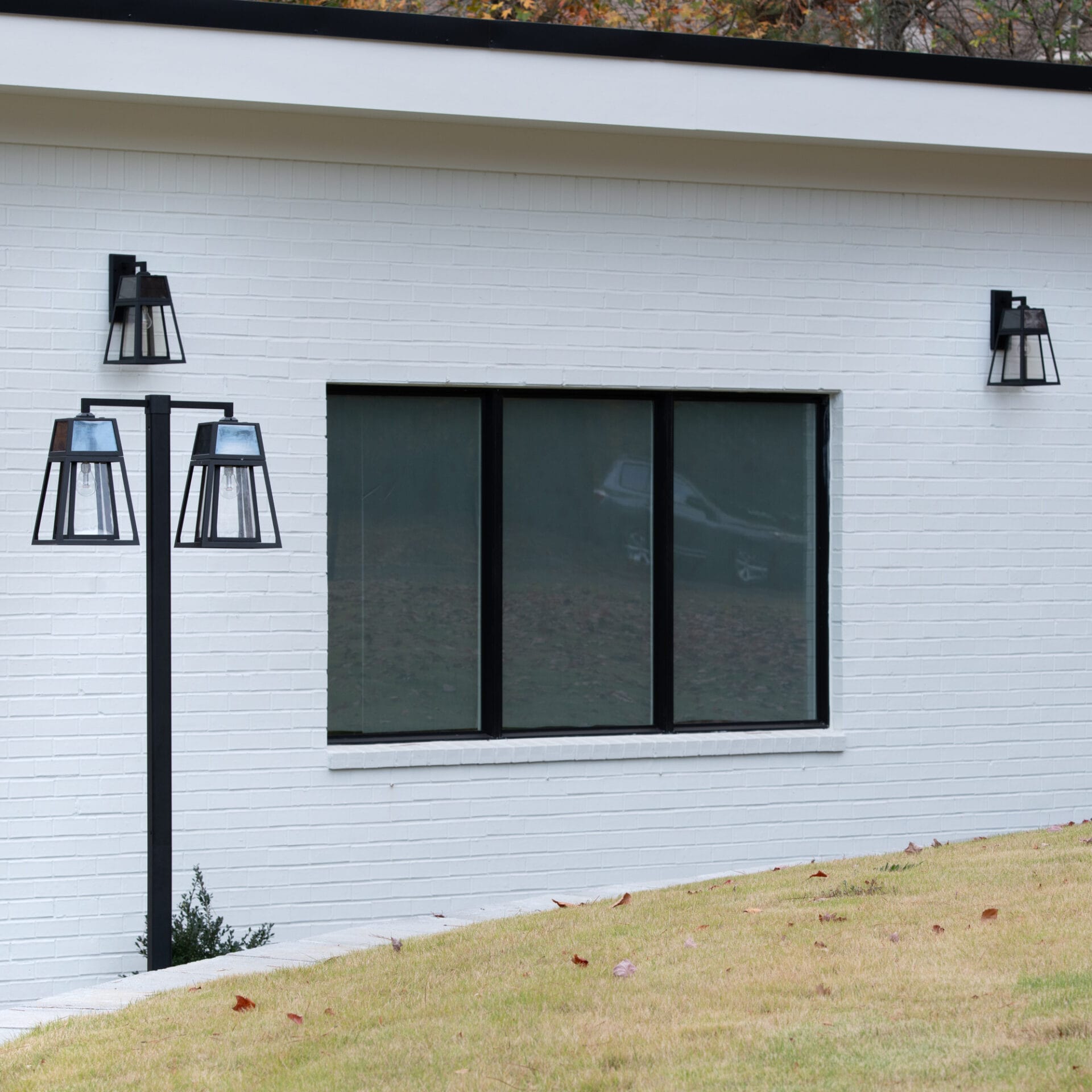 Gama Sonic Aria Dual-Head Solar Post Light illuminating driveway